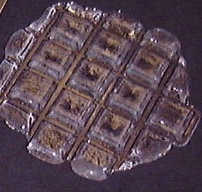 Boron oxide glass pressing frangibly linked transparent squares black background